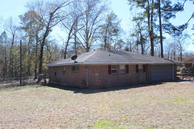 view of side of property with a garage