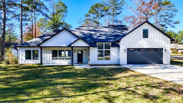 modern farmhouse featuring a front yard, a porch, and a garage