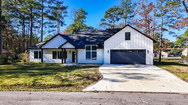 modern farmhouse with a front lawn and a garage