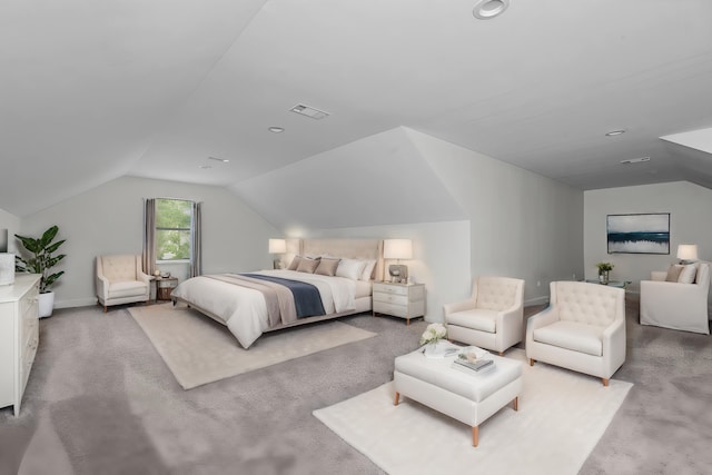 bedroom featuring light carpet and lofted ceiling