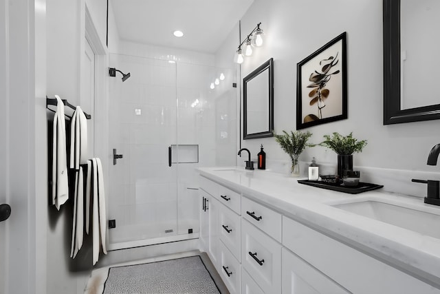 bathroom with vanity and an enclosed shower