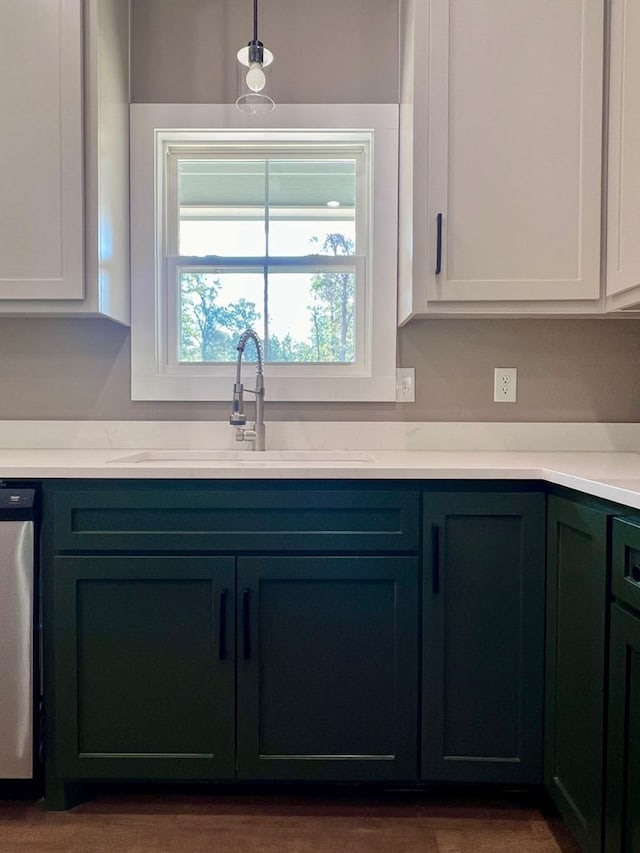 105 Cooper Rd, Zavalla, TX 75980 - kitchen featuring stainless steel dishwasher, decorative light fixtures, and white cabinets