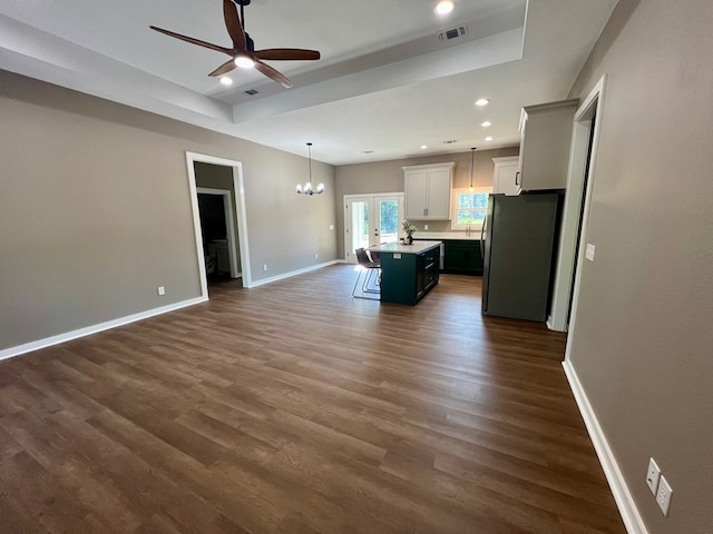 105 Cooper Rd, Zavalla, TX 75980 - kitchen with freestanding refrigerator, open floor plan, a kitchen island with sink, ceiling fan, and a chandelier