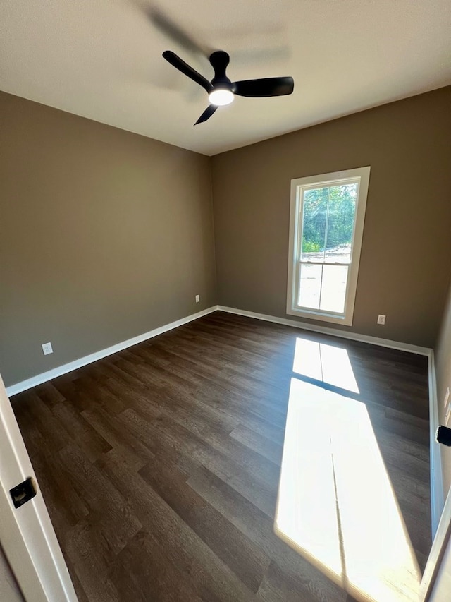 105 Cooper Rd, Zavalla, TX 75980 - empty room with dark wood-type flooring and ceiling fan
