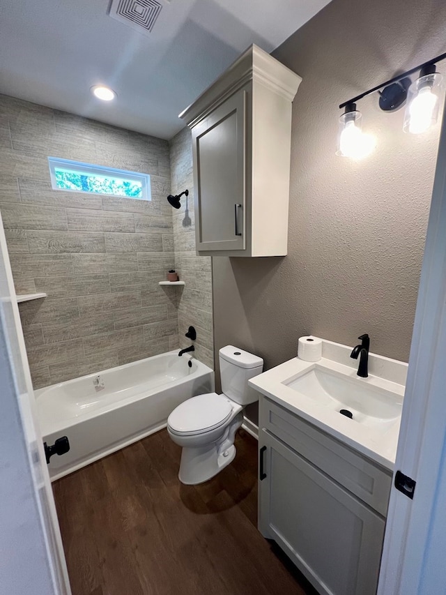 105 Cooper Rd, Zavalla, TX 75980 - bathroom featuring bathing tub / shower combination, wood finished floors, and vanity