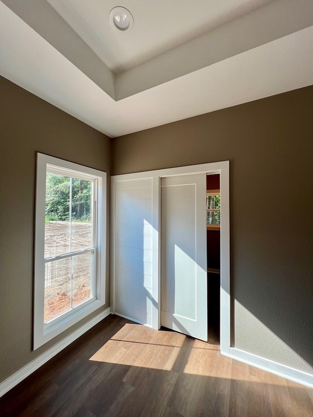 105 Cooper Rd, Zavalla, TX 75980 - unfurnished bedroom with wood finished floors and baseboards