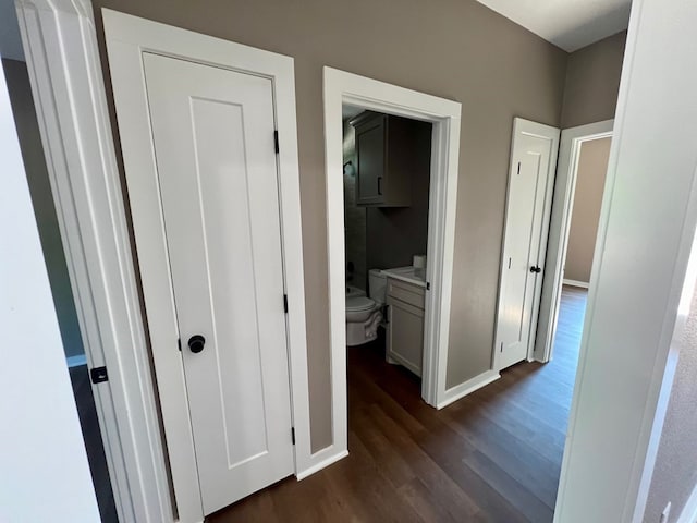 105 Cooper Rd, Zavalla, TX 75980 - hallway with dark wood finished floors and baseboards