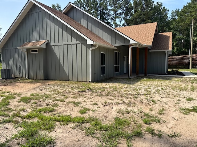 105 Cooper Rd, Zavalla, TX 75980 - back of property featuring roof with shingles and board and batten siding