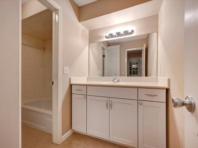 bathroom featuring vanity, tile patterned floors, and  shower combination