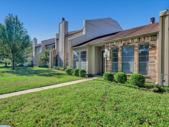 exterior space featuring a front lawn