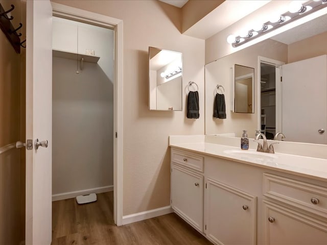 bathroom featuring hardwood / wood-style floors and vanity