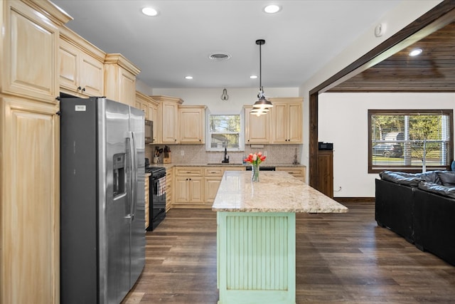 kitchen featuring stainless steel refrigerator with ice dispenser, a kitchen island, hanging light fixtures, and dark wood-type flooring