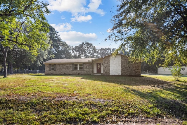 rear view of house with a lawn