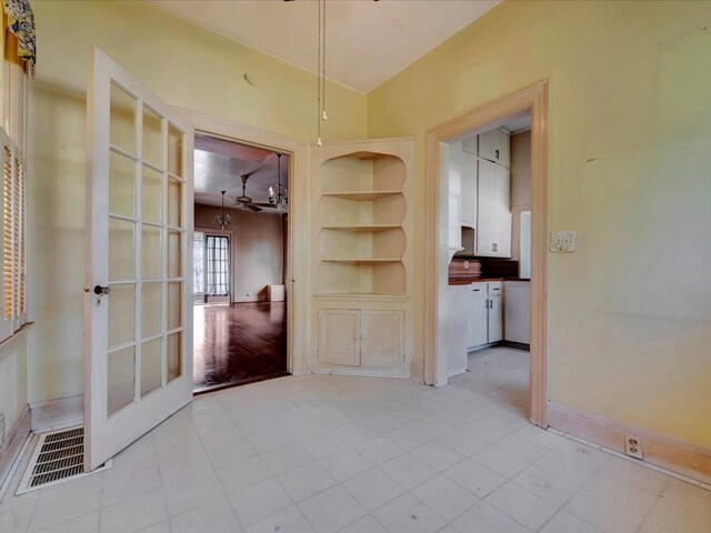 interior space with light hardwood / wood-style flooring and french doors