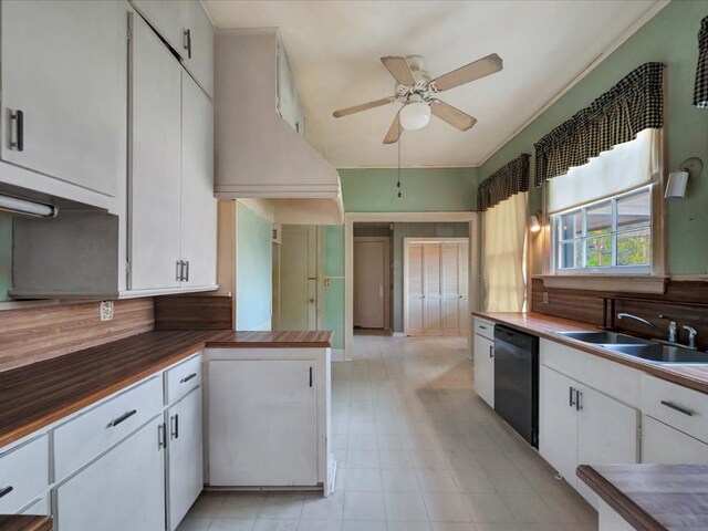 kitchen with ceiling fan, sink, white cabinetry, and black dishwasher