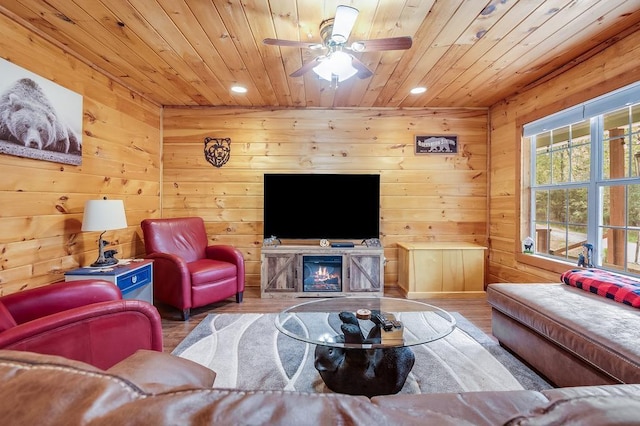 living area featuring recessed lighting, wood finished floors, and wooden ceiling