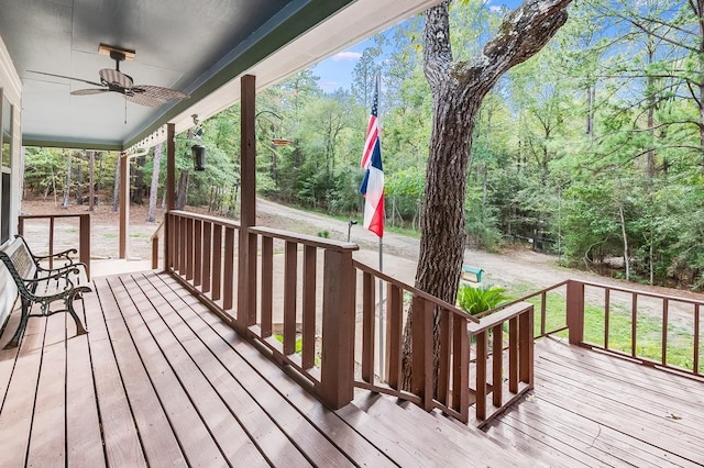 wooden deck featuring a ceiling fan