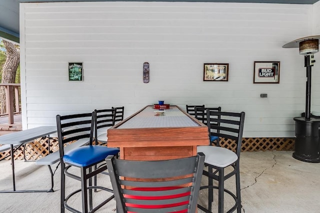 view of patio / terrace featuring outdoor dining area and an outdoor bar