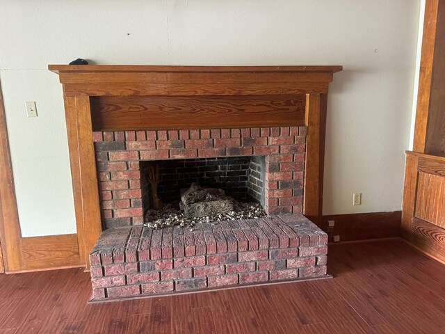 805 Worth St, Hemphill, TX 75948 - room details with baseboards, wood finished floors, and a fireplace