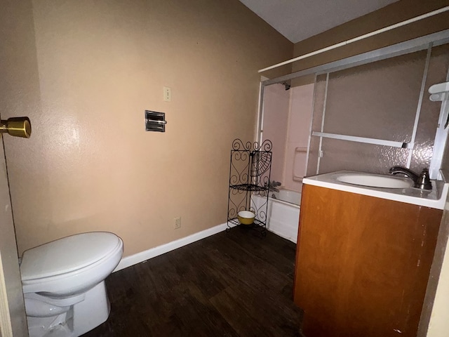 805 Worth St, Hemphill, TX 75948 - bathroom with vanity, baseboards, bathing tub / shower combination, toilet, and wood finished floors