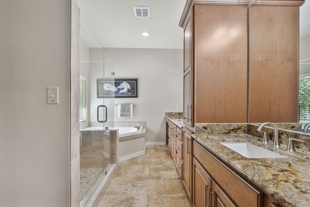 bathroom featuring vanity and separate shower and tub