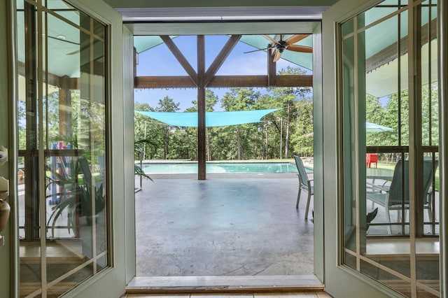 doorway to outside with ceiling fan