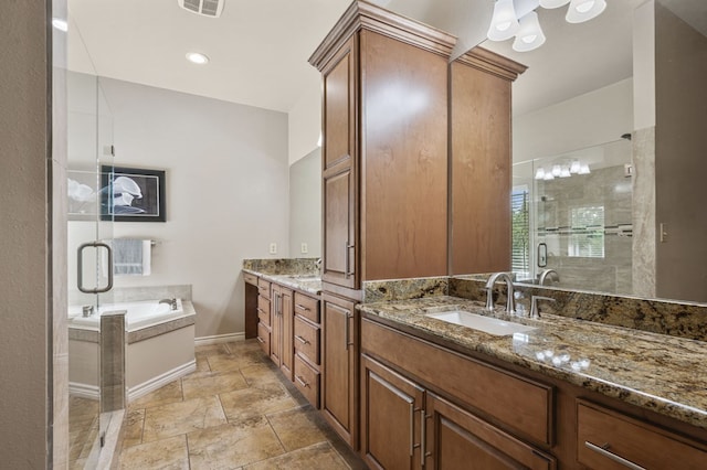 bathroom featuring vanity and shower with separate bathtub