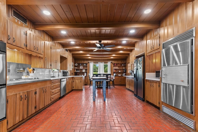 915 Evans Dr, Lufkin, TX 75904 - kitchen featuring stainless steel appliances, a ceiling fan, a wooden ceiling with exposed beams, light countertops, and tasteful backsplash