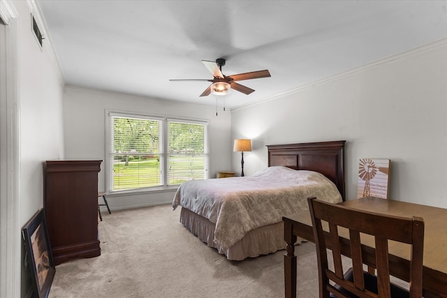 915 Evans Dr, Lufkin, TX 75904 - bedroom with crown molding, light carpet, and a ceiling fan