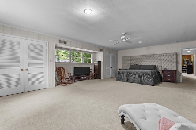 915 Evans Dr, Lufkin, TX 75904 - carpeted bedroom featuring ceiling fan and ornamental molding