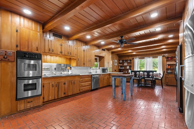 915 Evans Dr, Lufkin, TX 75904 - kitchen featuring stainless steel appliances, light countertops, brick flooring, a wooden ceiling with exposed beams, and a ceiling fan