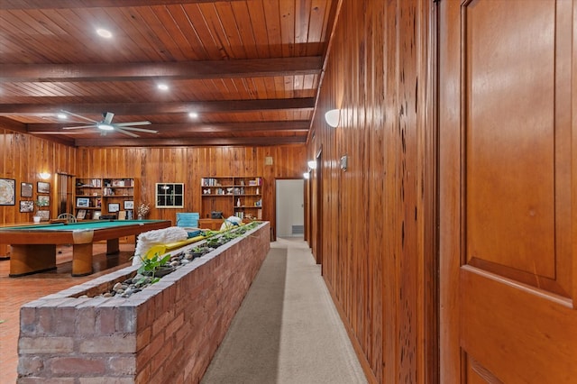 915 Evans Dr, Lufkin, TX 75904 - interior space featuring a wood ceiling with exposed beams, wood walls, billiards table, ceiling fan, and light carpet