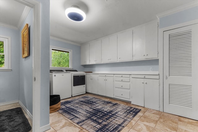 915 Evans Dr, Lufkin, TX 75904 - kitchen with washing machine and clothes dryer, ornamental molding, white cabinetry, and light countertops
