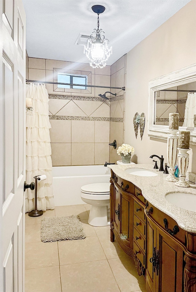 full bathroom featuring tile patterned floors, vanity, toilet, and shower / tub combo with curtain