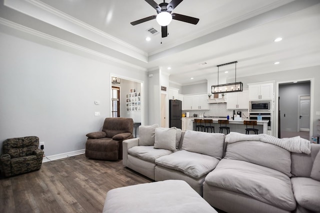 169 Shady Oaks Loop, Lufkin, TX 75904 - living room featuring ceiling fan, crown molding, dark wood finished floors, and recessed lighting