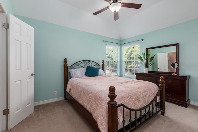 carpeted bedroom featuring vaulted ceiling and ceiling fan