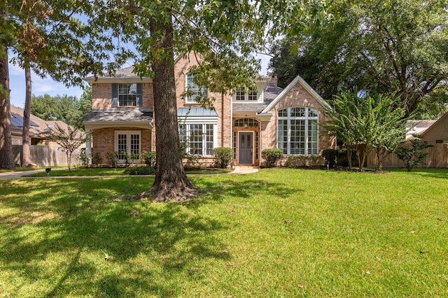 exterior space featuring french doors and a front yard