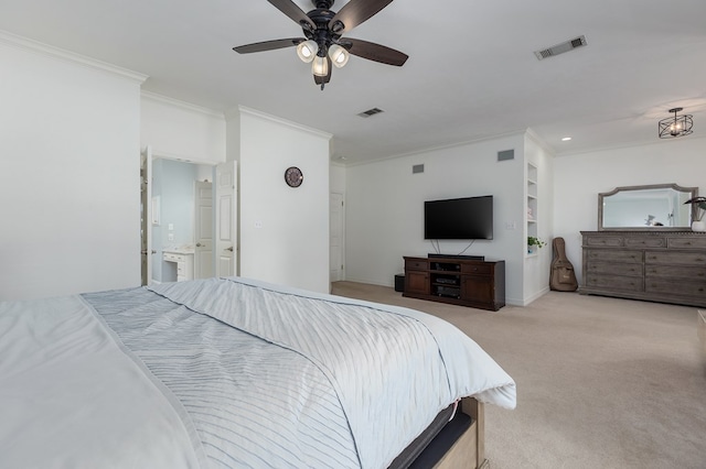 carpeted bedroom with ensuite bathroom, ceiling fan, and crown molding