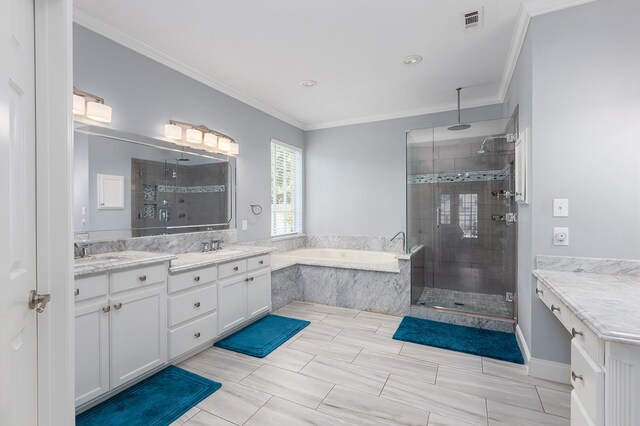 bathroom featuring vanity, crown molding, and plus walk in shower