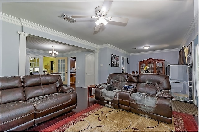 living room with hardwood / wood-style flooring, ceiling fan with notable chandelier, ornamental molding, and french doors