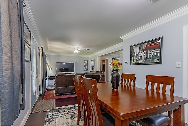 dining room featuring hardwood / wood-style flooring, ceiling fan, and crown molding