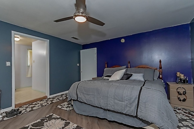 bedroom with light wood-type flooring and ceiling fan