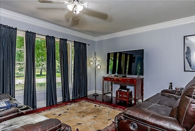 living room featuring crown molding, hardwood / wood-style floors, and ceiling fan