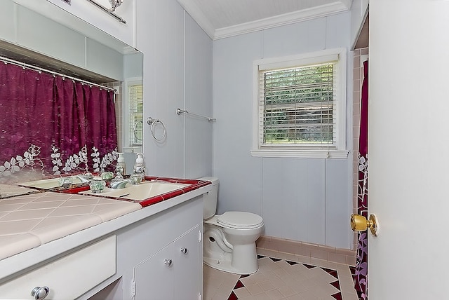 bathroom with tile patterned flooring, vanity, toilet, and crown molding