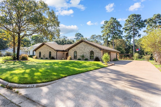 ranch-style home featuring a front yard