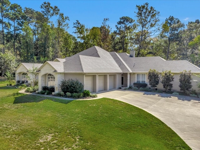 ranch-style home with roof with shingles, a front lawn, a chimney, concrete driveway, and a garage