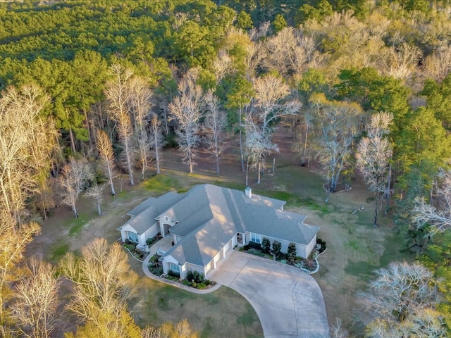 aerial view featuring a wooded view