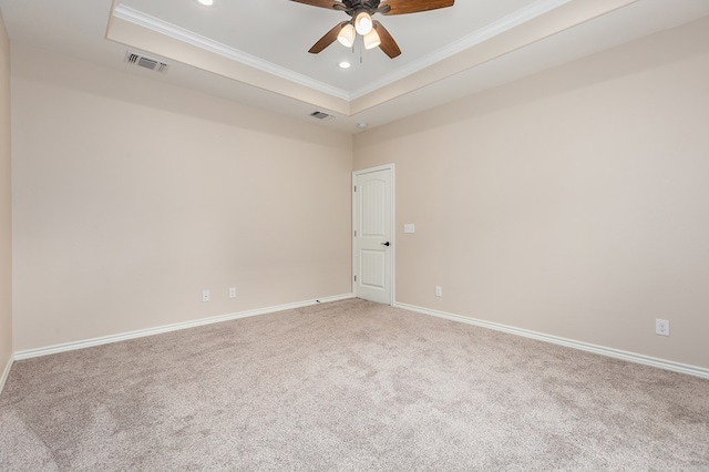 211 Rustic Pines Dr, Lufkin, TX 75904 - spare room with ornamental molding, a raised ceiling, light colored carpet, ceiling fan, and recessed lighting