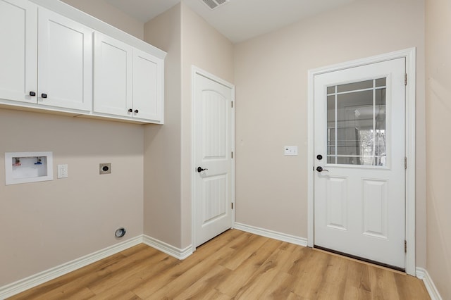 211 Rustic Pines Dr, Lufkin, TX 75904 - laundry room with hookup for an electric dryer, light wood-style floors, cabinet space, and hookup for a washing machine