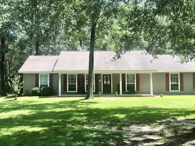 ranch-style house with a porch and a front yard